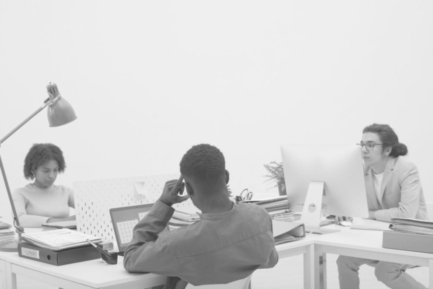 Diverse students collaborating on a web design project in a modern classroom setting